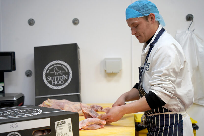 Levi breaking down whole cuts in the Bodiam Foods cutting room